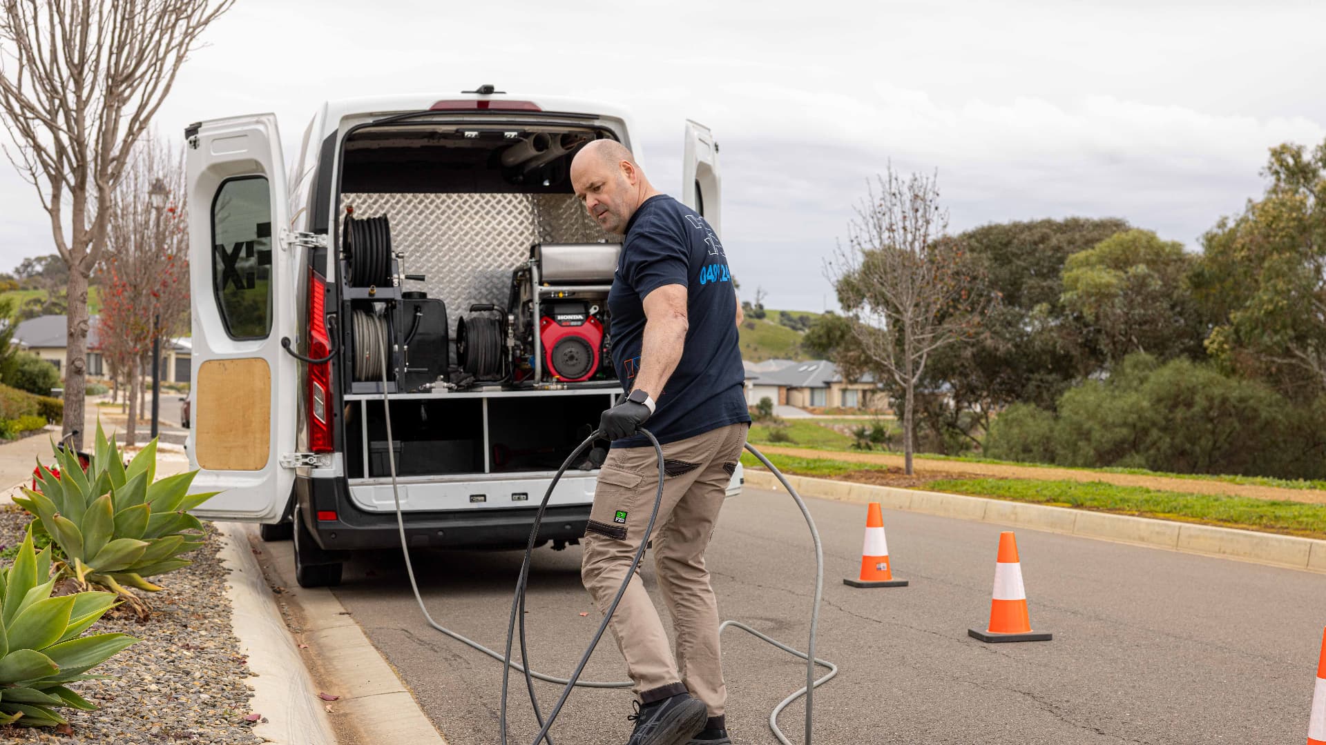 Fixara plumber unloading a high pressure jetter from the van for an urgent blocked drain call