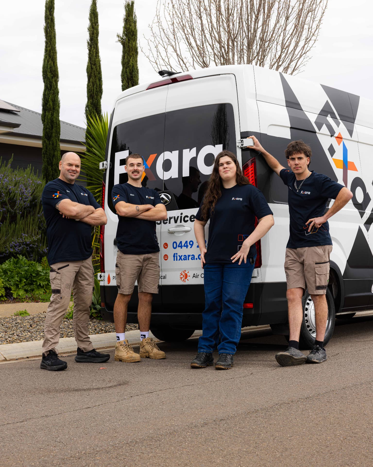 The Fixara plumbing team standing in front of the service van